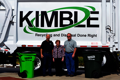 Kimble employees and customer in front of a Kimble truck.